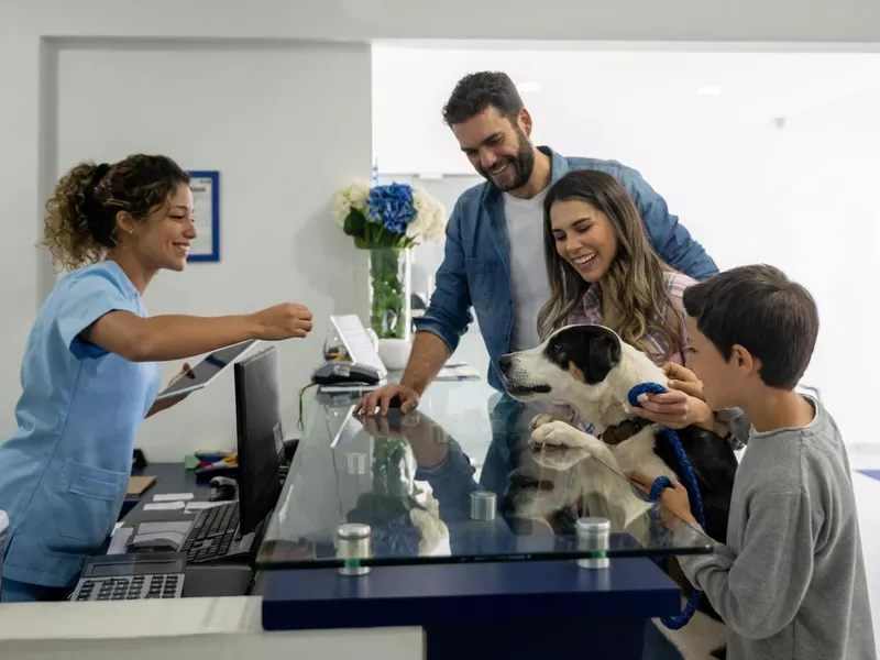 Family taking their dog to the vet
