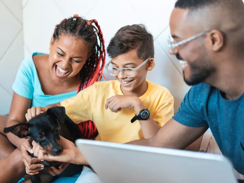 Family having fun with their pet