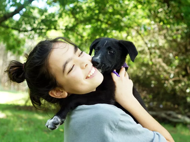 Girl with her puppy dog